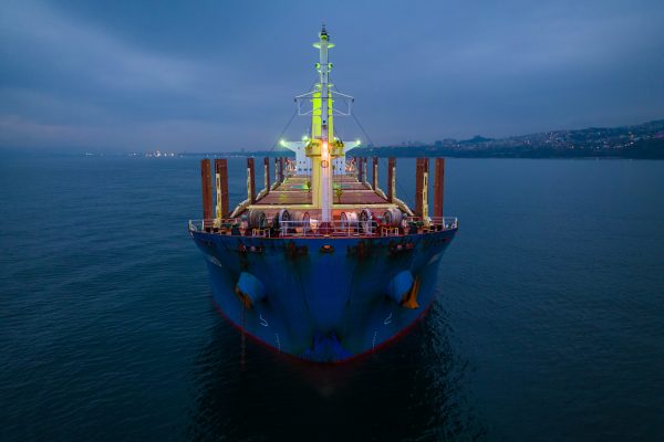 Aerial view cargo bulk carrier ship on the sea at night