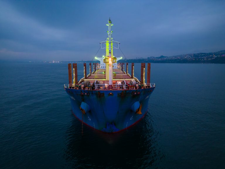 Aerial view cargo bulk carrier ship on the sea at night