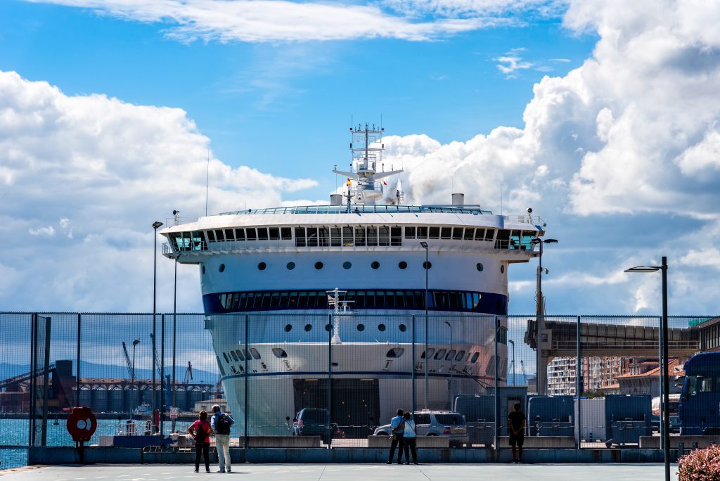 Ferry ship loading cars in the terminal of a port