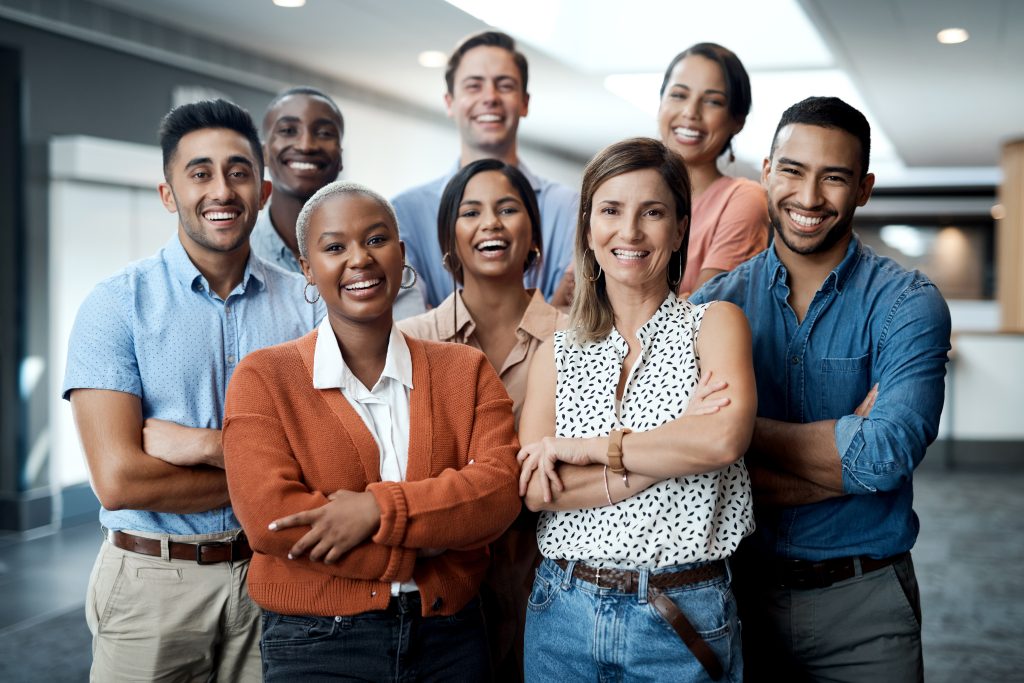 Portrait of a group of confident young businesspeople working together in a modern office.